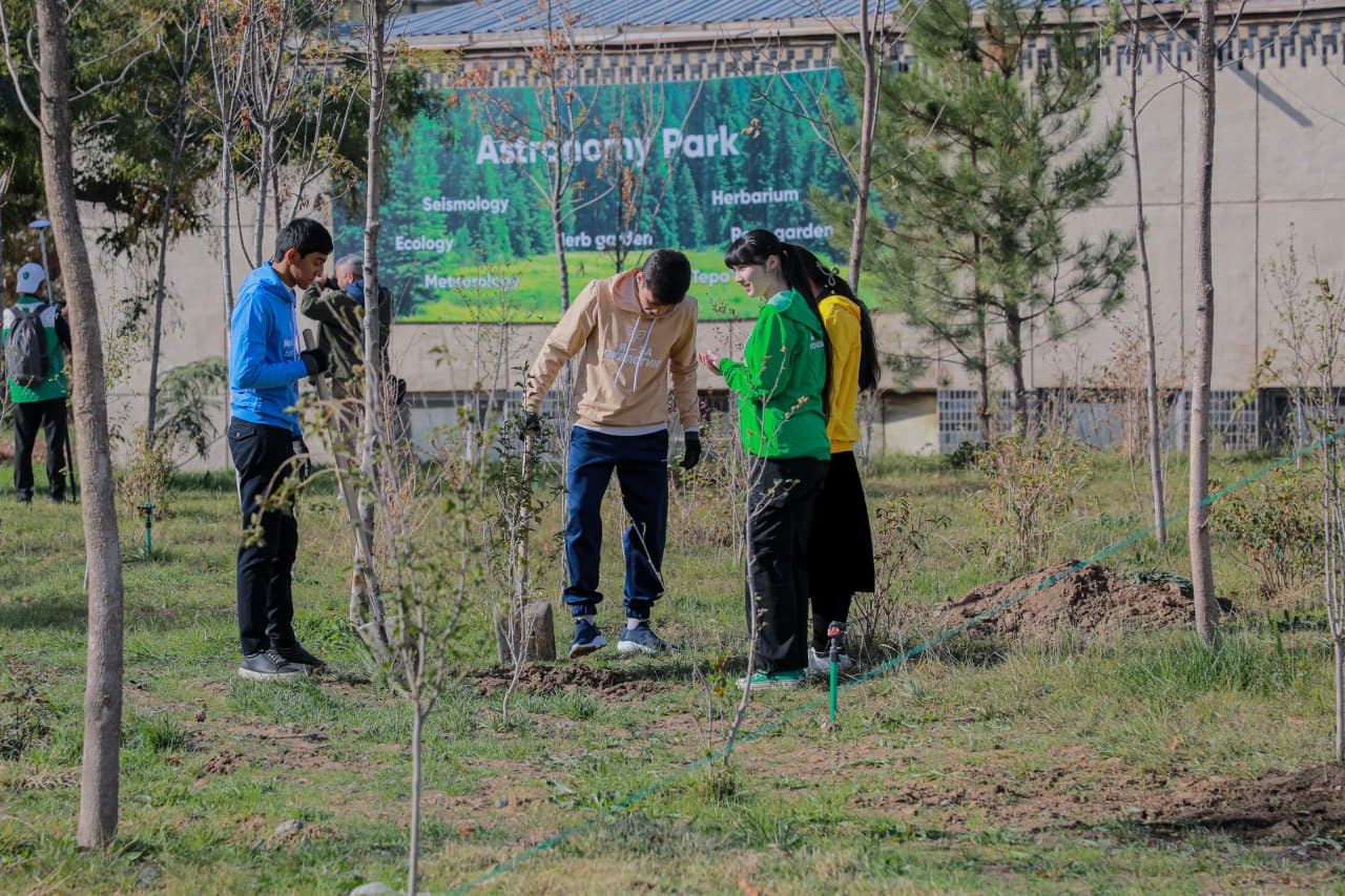 Young environmentalists plant trees at the park of Astronomy