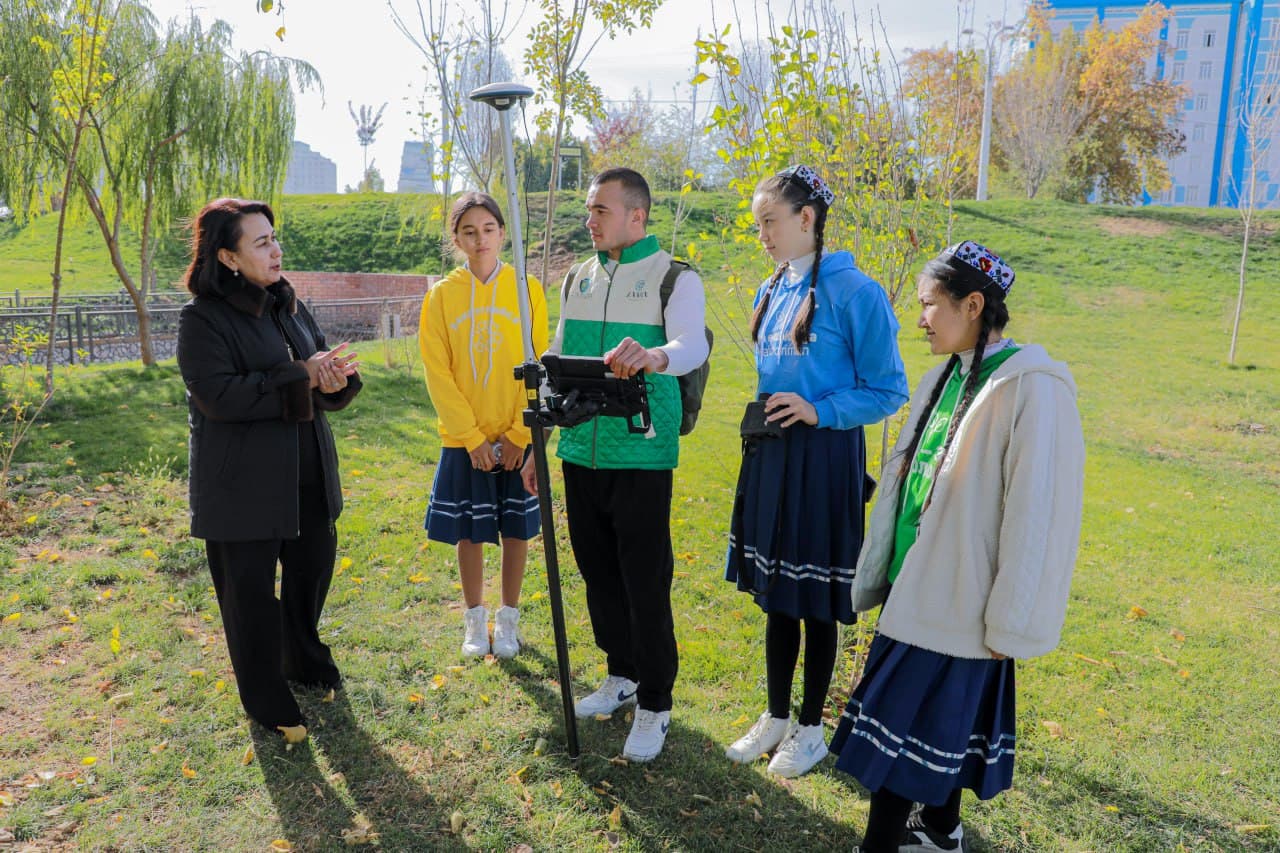 Young environmentalists plant trees at the park of Astronomy