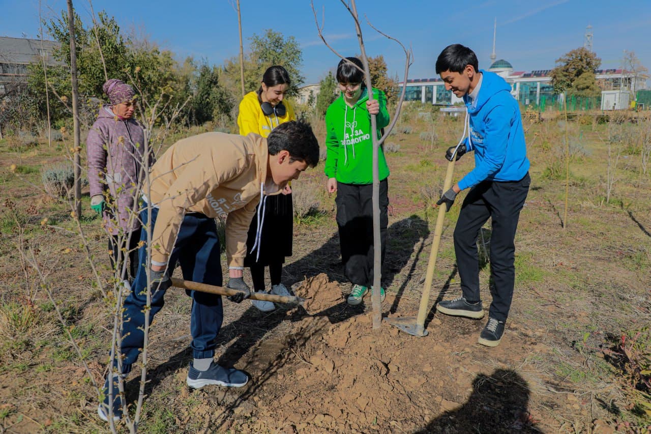 Young environmentalists plant trees at the park of Astronomy