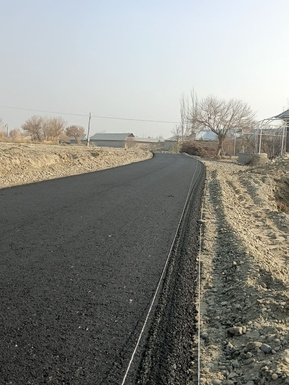 Қоракўл: “Ташаббусли бюджет” туфайли Қуйи Янгибозор маҳалласи йўли асфальтлаштирилмоқда